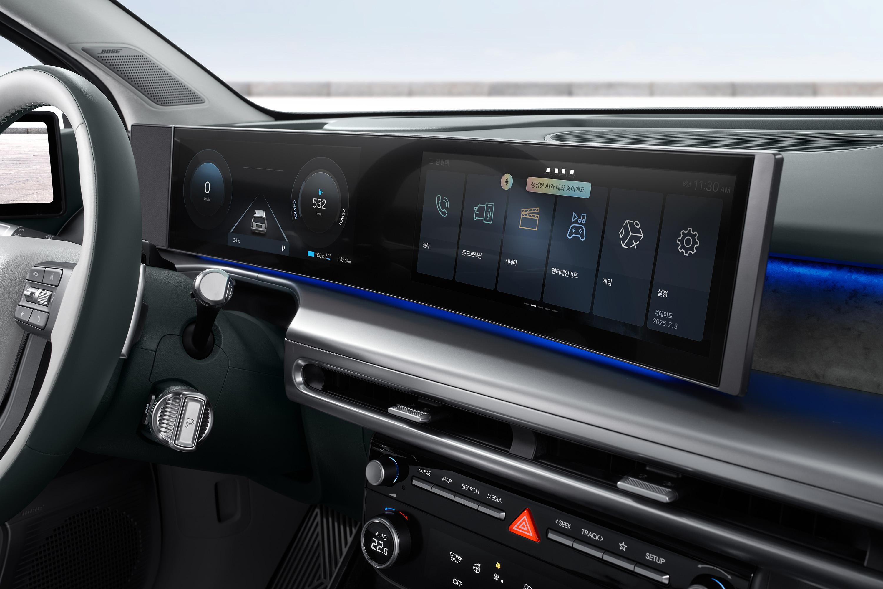 Curved panoramic display of the IONIQ 9 showing Hyundai AI Assistant.