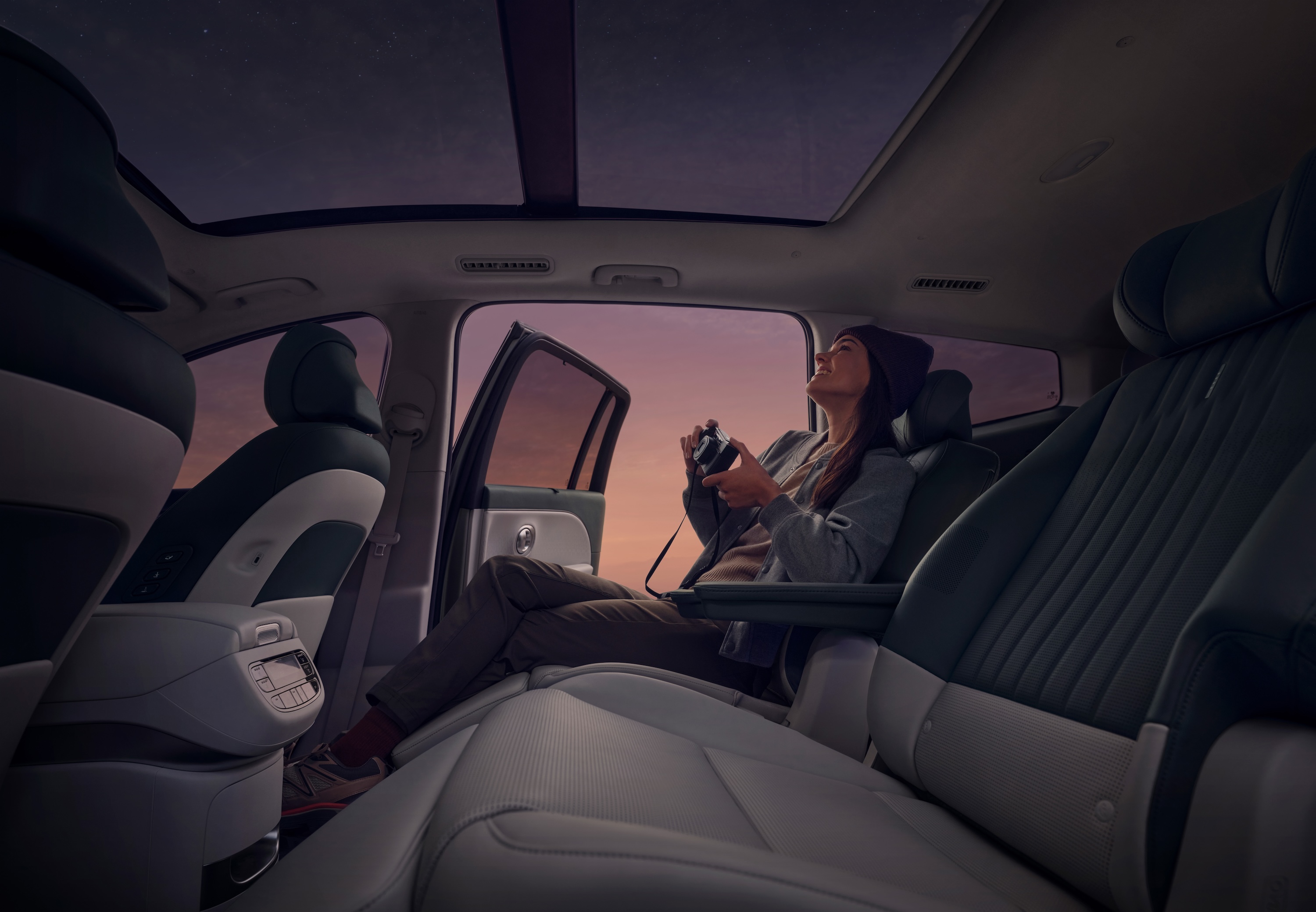 A woman seating on relaxation seats in the second row of the Hyundai IONIQ 9.